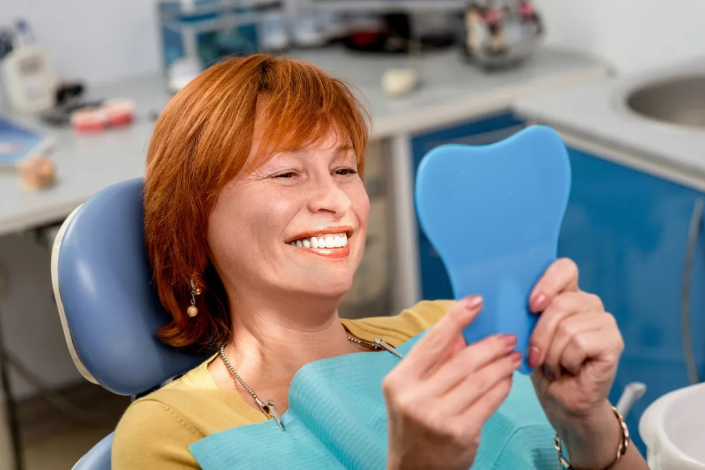 Patient admiring her healthy gums