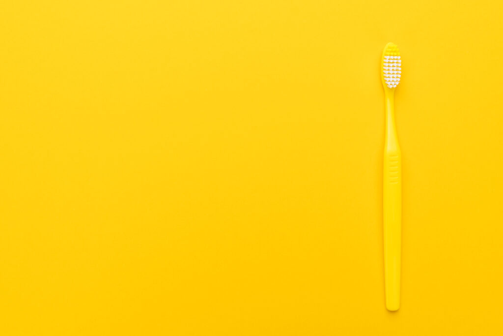 Yellow tooth brush helps in keeping your dentures clean. 